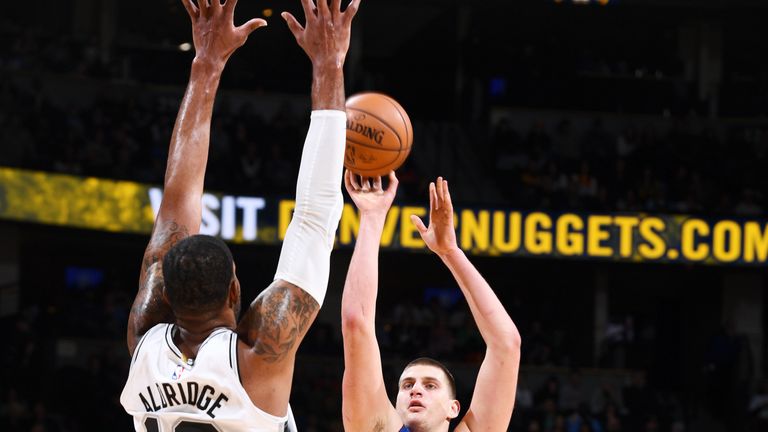 Nikola Jokic shoots over LaMarcus Aldridge
