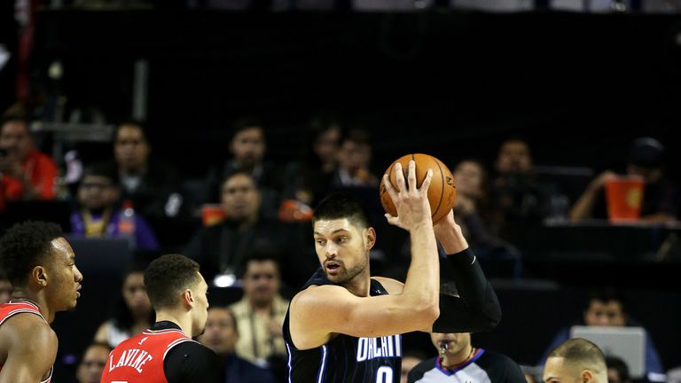 Nikola Vucevic protects the ball from Zach LaVine