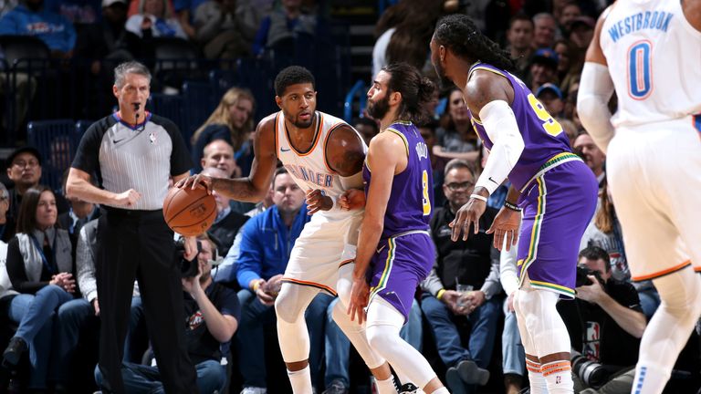 Paul George backs down Utah's Ricky Rubio