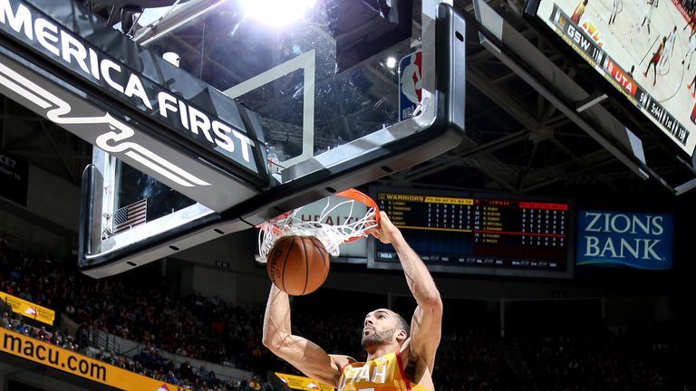 Rudy Gobert dunks on his way to a double-double