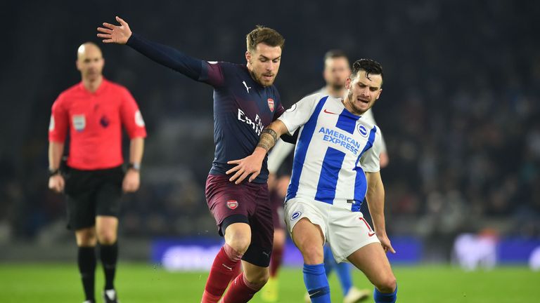 Aaron Ramsey battles for possession with Pascal Gross