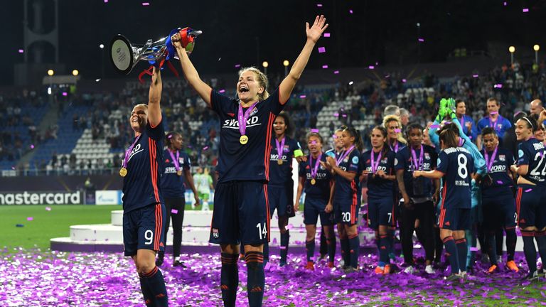 Ada Hegerberg and Eugenie Le Sommer celebrate Olympique Lyon's Champions League Final victory over Wolfsburg