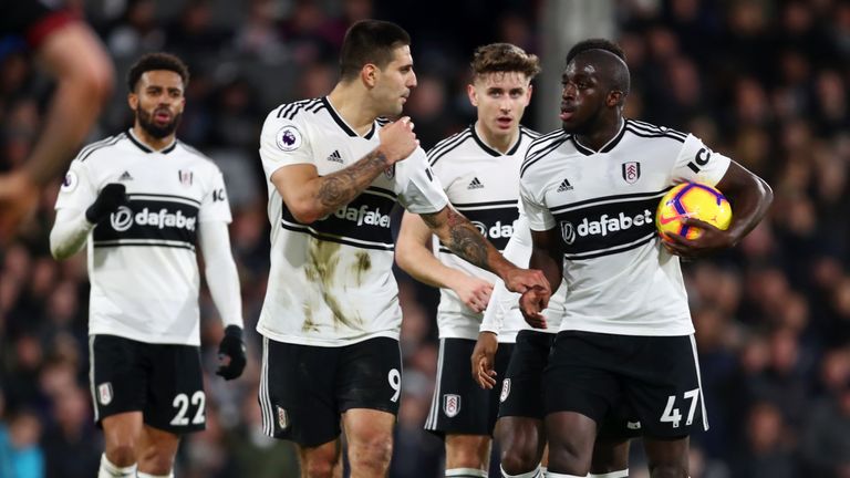 Aleksandar Mitrovic argued with  Aboubakar Kamara over who should take a late penalty against Huddersfield