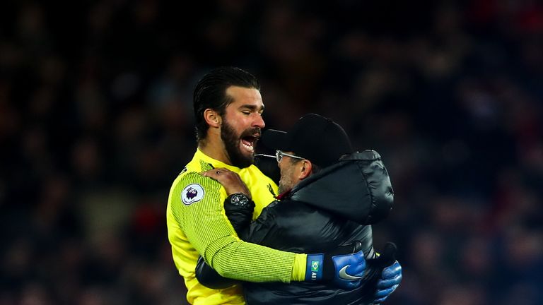 Jurgen Klopp celebrates with Liverpool goalkeeper Alisson