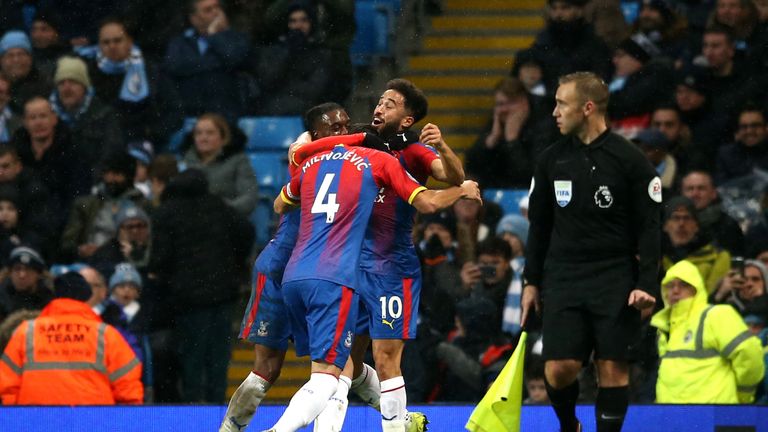 Andros Townsend celebrates his stunning goal against Manchester City

