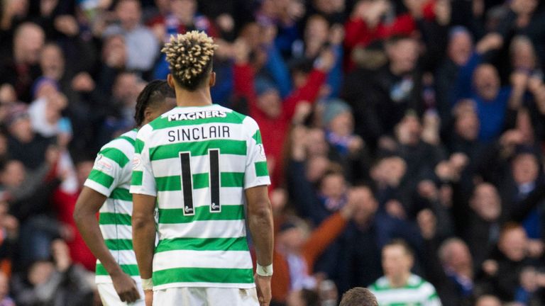 Rangers' Andy Halliday celebrates while Celtic's Scott Sinclair looks on