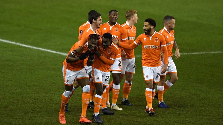 Armand Gnanduillet is congratulated for his goal in Blackpool's victory