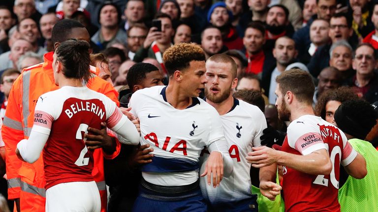 Players from both sides clash following Tottenham's equaliser