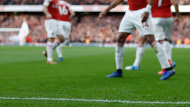 A banana skin thrown from the crowd is seen on the pitch at the Emirates Stadium