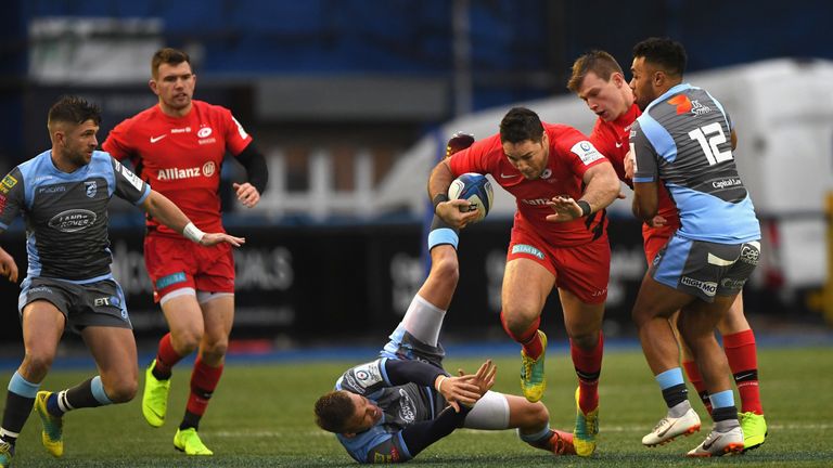 Saracens' Brad Barritt crashes through the Blues' midfield defence