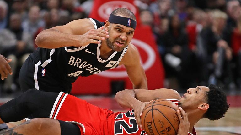 Cameron Payne of the Chicago Bulls is pressured by pressure from Jared Dudley of the Brooklyn Nets
