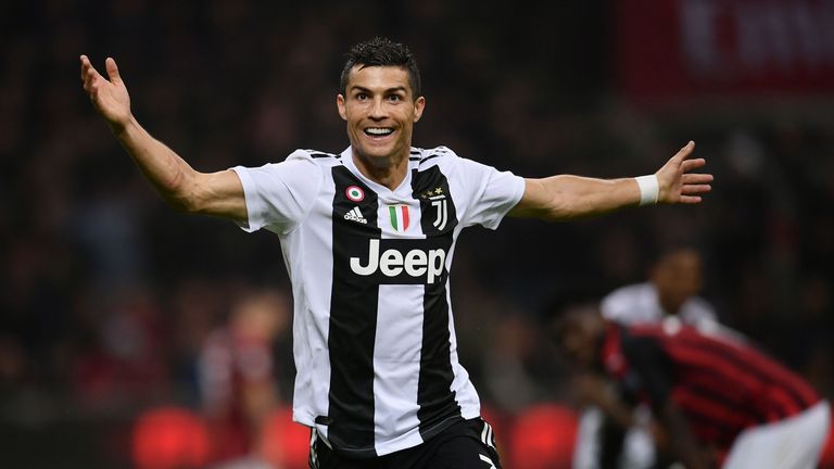 Cristiano Ronaldo celebrates after scoring during the Serie A match between AC Milan and Juventus