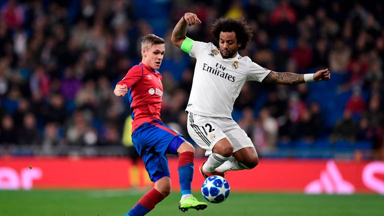 CSKA Moscow's Icelandic midfielder Arnor Sigurdsson (L) vies with Real Madrid's Brazilian defender Marcelo during the UEFA Champions League group G football match between Real Madrid CF and CSKA Moscow at the Santiago Bernabeu stadium in Madrid on December 12, 2018