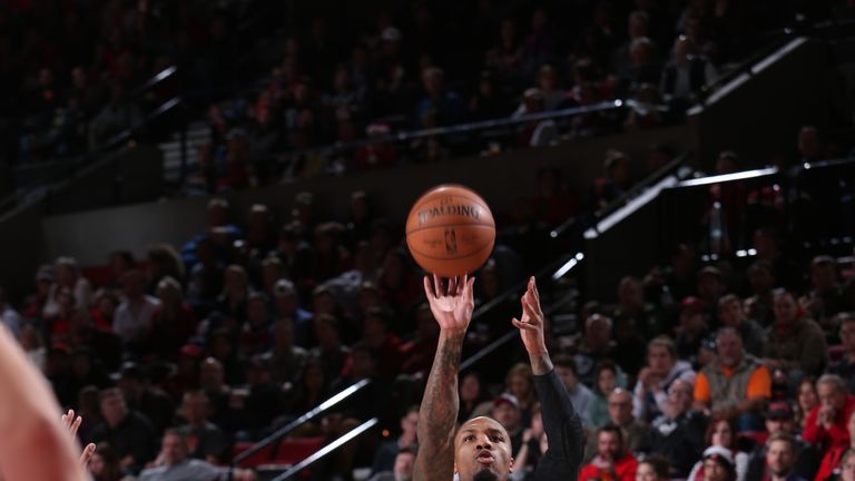 Damian Lillard #0 of the Portland Trail Blazers shoots the ball against the Minnesota Timberwolves on December 8, 2018 at the Moda Center Arena in Portland, Oregon.