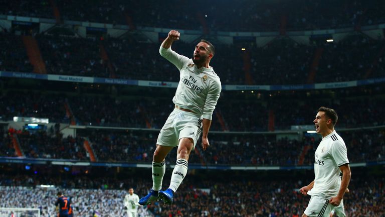 Daniel Carvajal of Real Madrid celebrates as Daniel Wass of Valencia scores an own goal for their first goal during the La Liga match between Real Madrid CF and Valencia CF at Estadio Santiago Bernabeu on December 01, 2018 in Madrid, Spain.