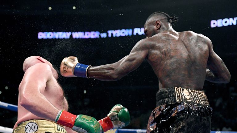 Deontay Wilder knocks Tyson Fury down during the 12th round resulting in a draw during the WBC Heavyweight Champioinship at Staples Center on December 1, 2018 in Los Angeles, California.  (Photo by Harry How/Getty Images)