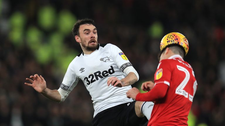 Derby County's Scott Malone and Nottingham Forest's Joe Lolley (right) battle for the ball