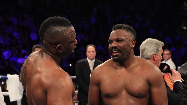 Dillian Whyte of Brixton (L) and Dereck Chisora of Finchley speak after their WBC World Heavyweight Title Eliminator & WBC International Championship fight at Manchester Arena on December 10, 2016 