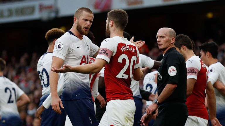 Tottenham Hotspur's English defender Eric Dier (centre left) and Arsenal's German defender Shkodran Mustafi clash after Dier celebrates his equalizer during the English Premier League football match between Arsenal and Tottenham Hotspur at the Emirates Stadium in London on December 2, 2018.