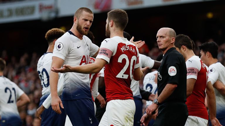 Tottenham Hotspur&#39;s English defender Eric Dier (centre left) and Arsenal&#39;s German defender Shkodran Mustafi clash after Dier celebrates his equalizer during the English Premier League football match between Arsenal and Tottenham Hotspur at the Emirates Stadium in London on December 2, 2018.