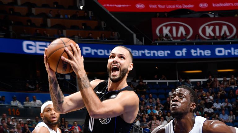 Evan Fournier #10 of the Orlando Magic drives through the paint during the game against Reggie Jackson #1 of the Detroit Pistons on December 30, 2018 at Amway Center in Orlando, Florida