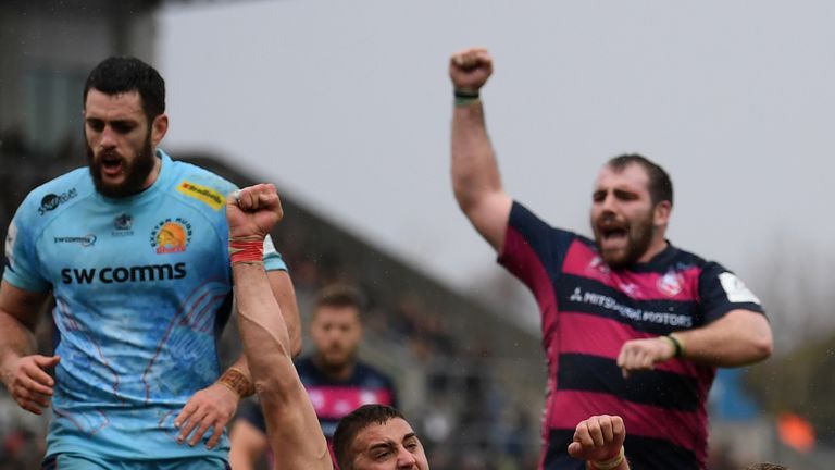 Freddie Clarke (L) and Fraser Balmain  (R) celebrate Gerbrandt Grobler  try  for Gloucester.