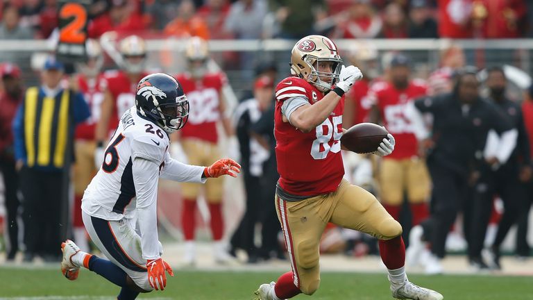 SANTA CLARA, CA - DECEMBER 09: George Kittle #85 of the San Francisco 49ers evades a tackled by Darian Stewart #26 of the Denver Broncos at Levi's Stadium on December 9, 2018 in Santa Clara, California. (Photo by Lachlan Cunningham/Getty Images)