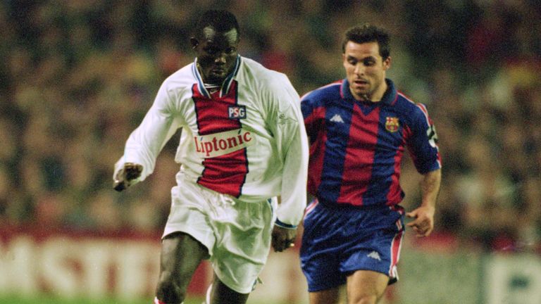 George Weah in action for Paris St Germain against Sergi of Barcelona in 1995