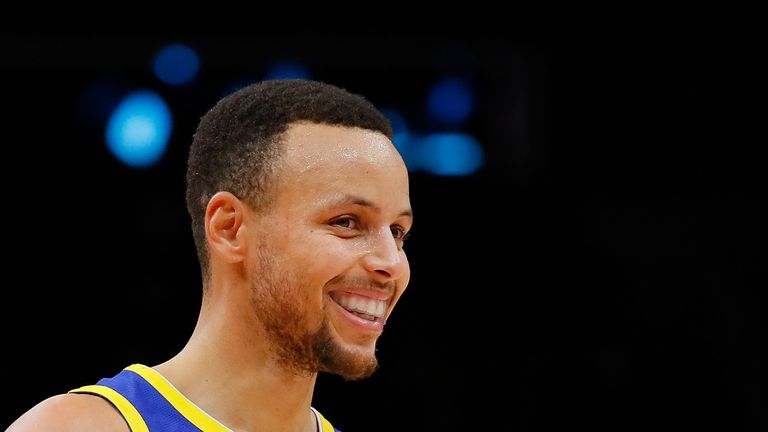 Stephen Curry of the Golden State Warriors reacts after hitting a three-point basket against the Atlanta Hawks 