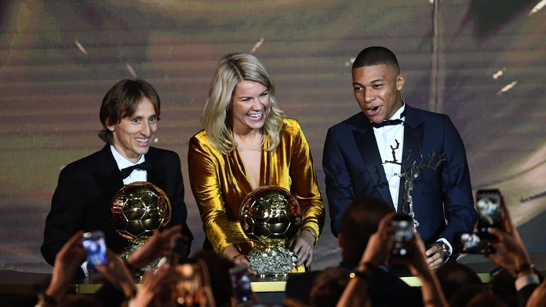 Ada Hegerberg (centre) collected the Ballon d&#39;Or alongside Luka Modric (left) and Kylian Mbappe