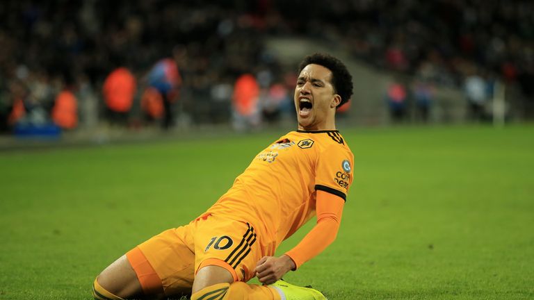 Helder Costa slides to his knees after scoring Wolves' third