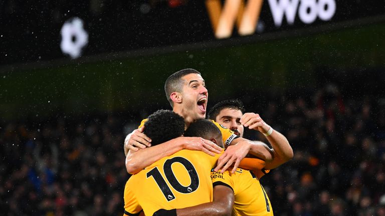 Ivan Cavaleiro is mobbed by team-mates after scoring Wolves' second goal