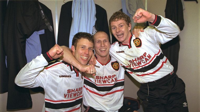 Jaap Stam, Ole Gunnar Solskjaer and Ronny Johnson of Manchester United celebrate in the dressing room after the FA Cup semi-final between Arsenal v Manchester United at Villa Park on April 4, 1999.