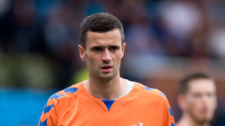 Jamie Murphy ion action for Rangers (orange away kit)