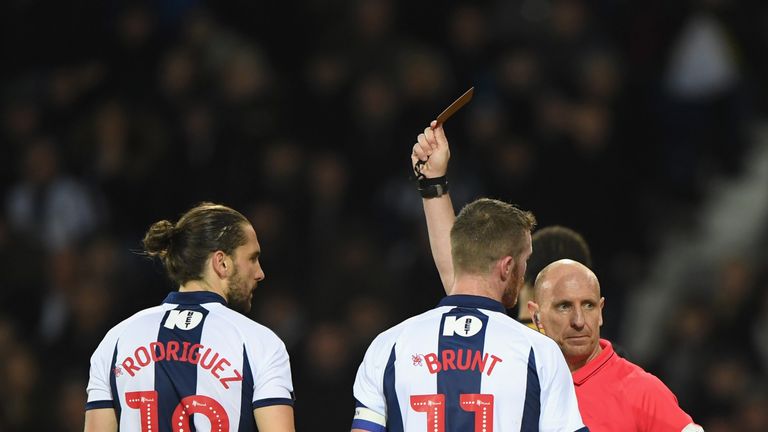 Referee Andy Davies red cards Jay Rodriguez (l) against Sheffield Wednesday