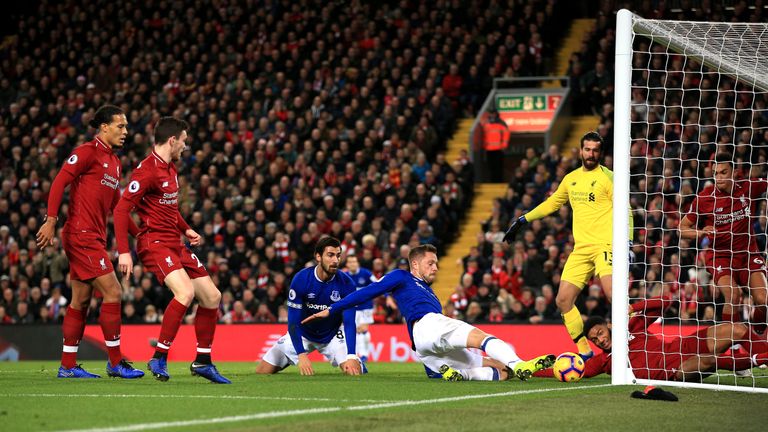 Joe Gomez clears off the line after Alisson&#39;s point-blank save from Andre Gomes