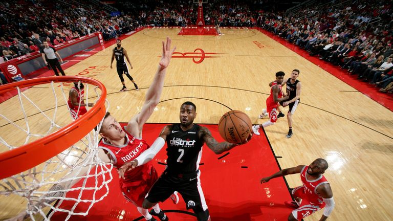 HOUSTON, TX - DECEMBER 19: John Wall #2 of the Washington Wizards shoots the ball during the game against the Houston Rockets on December 19, 2018 at the Toyota Center in Houston, Texas. NOTE TO USER: User expressly acknowledges and agrees that, by downloading and or using this photograph, User is consenting to the terms and conditions of the Getty Images License Agreement. Mandatory Copyright Notice: Copyright 2018 NBAE (Photo by Ned Dishman/NBAE via Getty Images)