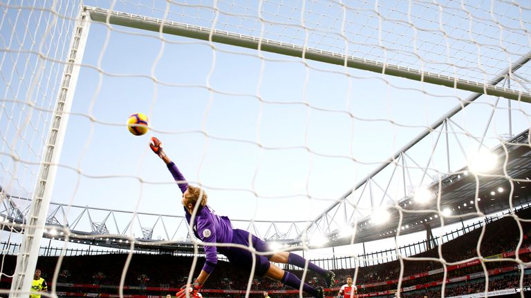 Jonas Lossl makes a save