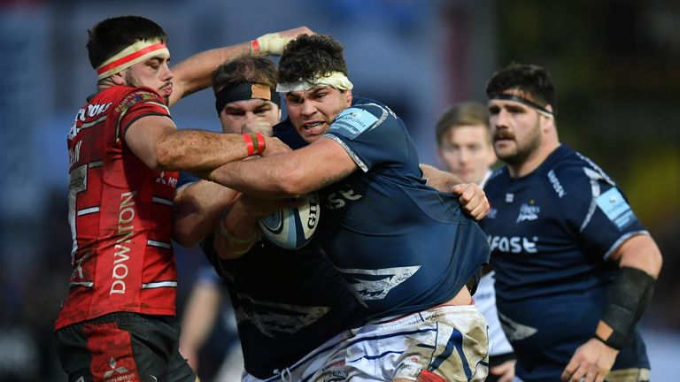 Jonathan Ross of Sale Sharks takes on Lewis Ludlow of Gloucester 