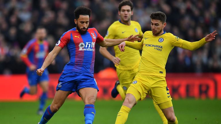 Jorginho challenges Andros Townsend for possession