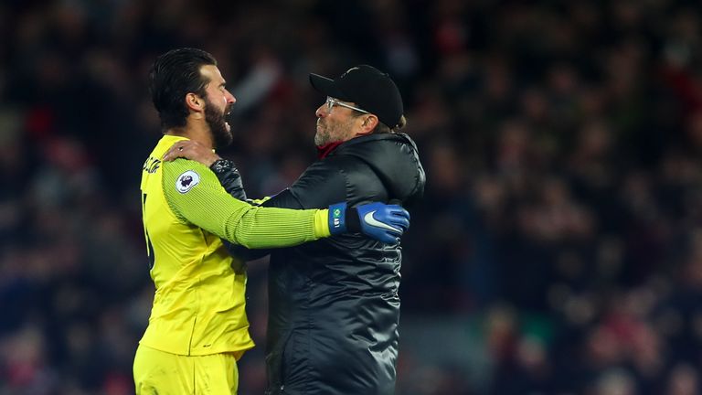 Jurgen Klopp celebrates with Liverpool goalkeeper Alisson