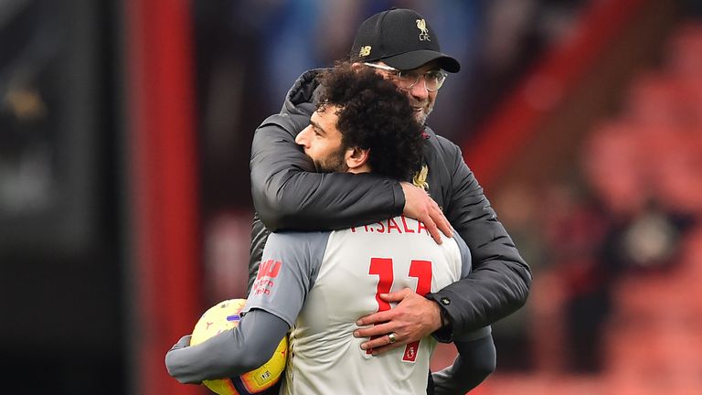 Jurgen Klopp embraces Mohamed Salah after the 4-0 away win over Bournemouth