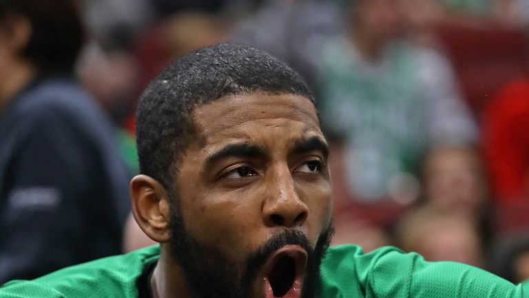 Kyrie Irving #11 of the Boston Celtics reacts on the bench after a teammate dunked against the Chicago Bulls at United Center on December 08, 2018 in Chicago, Illinois. The Celtics defeated the Bulls 133-77. 