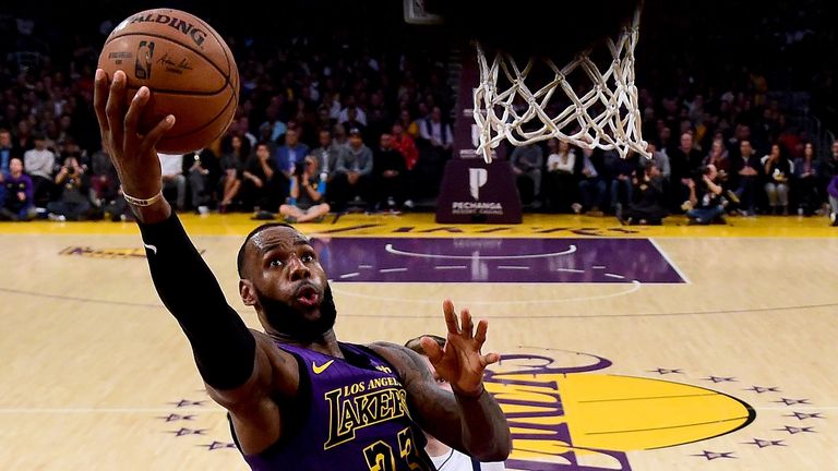 LeBron James #23 of the Los Angeles Lakers scores during a 114-103 win over the Dallas Mavericks at Staples Center on November 30, 2018 in Los Angeles, California.