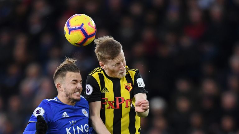 Leicester's James Maddison competes for a header with Watford's Will Hughes
