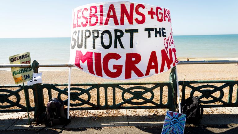 BRIGHTON, ENGLAND - AUGUST 06: A sign in support of migrants is displayed on the seafront ahead of the Brighton Pride Parade on August 6, 2016 in Brighton, England. (Photo by Tristan Fewings/Getty Images)