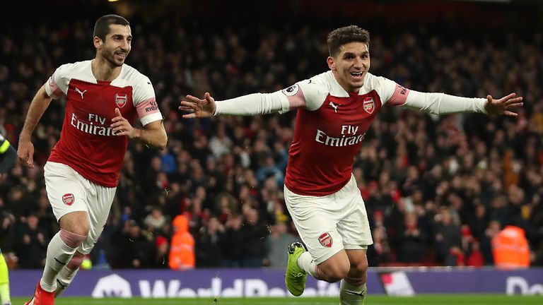Arsenal's Uruguayan midfielder Lucas Torreira (R) celebrates after scoring the opening goal of the English Premier League football match between Arsenal and Huddersfield Town at the Emirates Stadium in London on December 8, 2018