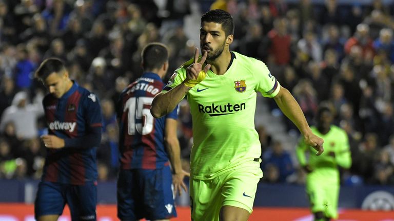 Luis Suarez celebrates stretching Barcelona's lead on Sunday evening