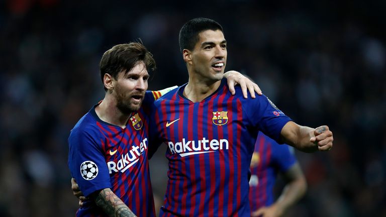 Lionel Messi celebrates with Luis Suarez during Barcelona's Champions League tie against Tottenham at Wembley
