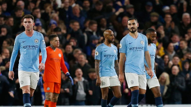 Manchester City players react to Chelsea's second goal